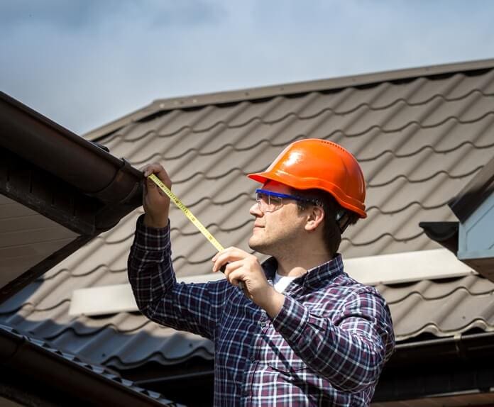 contractor inspecting roof