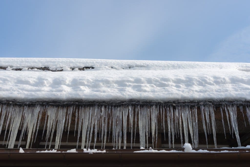 Ice dams and Icicles on a Roof