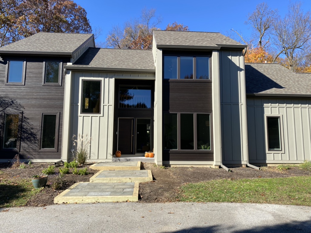 Close up after image of the front of a home in Malvern, PA that got James Hardie siding and vertical board installed by MHX Designs